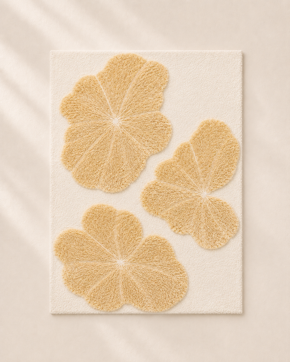 Hewn Earth Studio Lily rug featuring a floral design with soft pastel colors and intricate patterns on a woven fabric background.