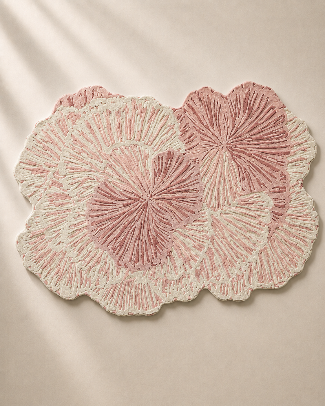 Pink Lotus rug by Hewn Earth Studio featuring a vibrant floral design on a soft textile background.