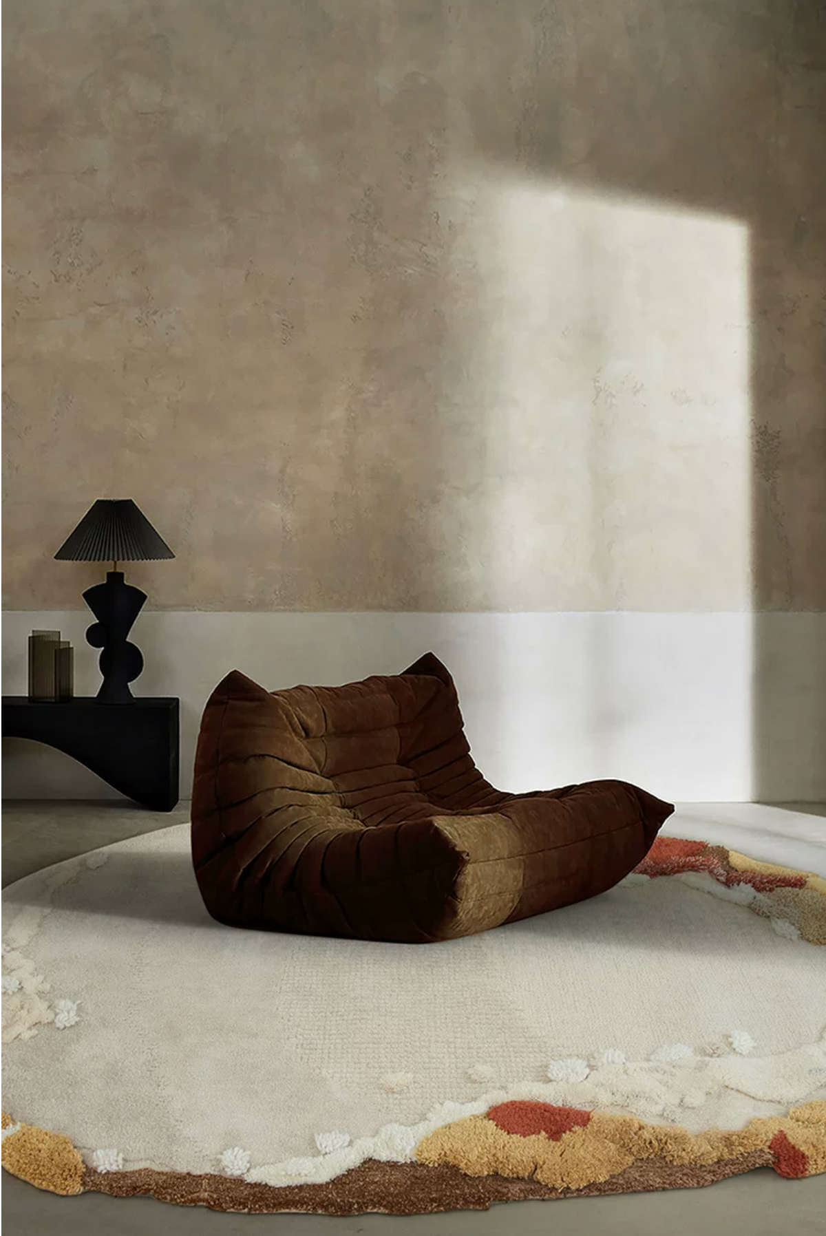 Hewn Earth Studio Meadow rug featuring autumn-inspired colors, woven pattern, and soft texture in a cozy room setting.