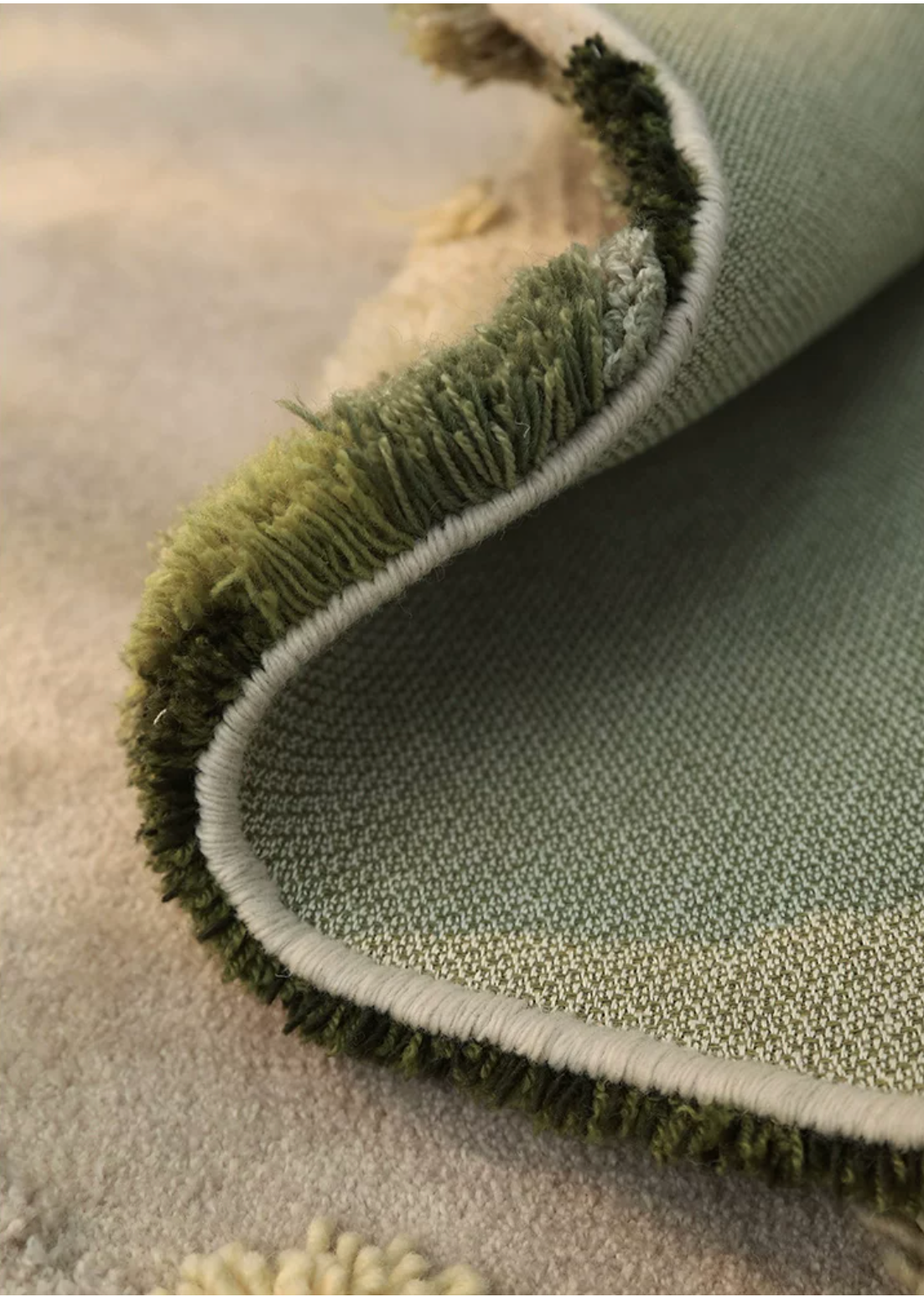 Hewn Earth Studio Meadow rug with intricate floral pattern, showcasing detailed back design in natural tones.