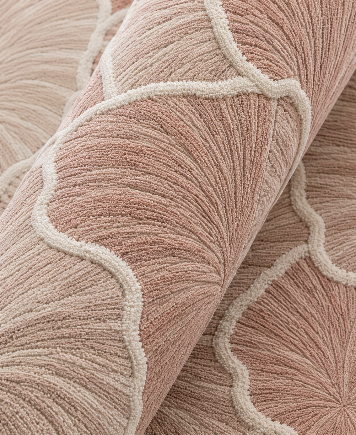 Close-up of Hewn Earth Studio Petal blush rug showing soft, textured fibers and intricate design details.