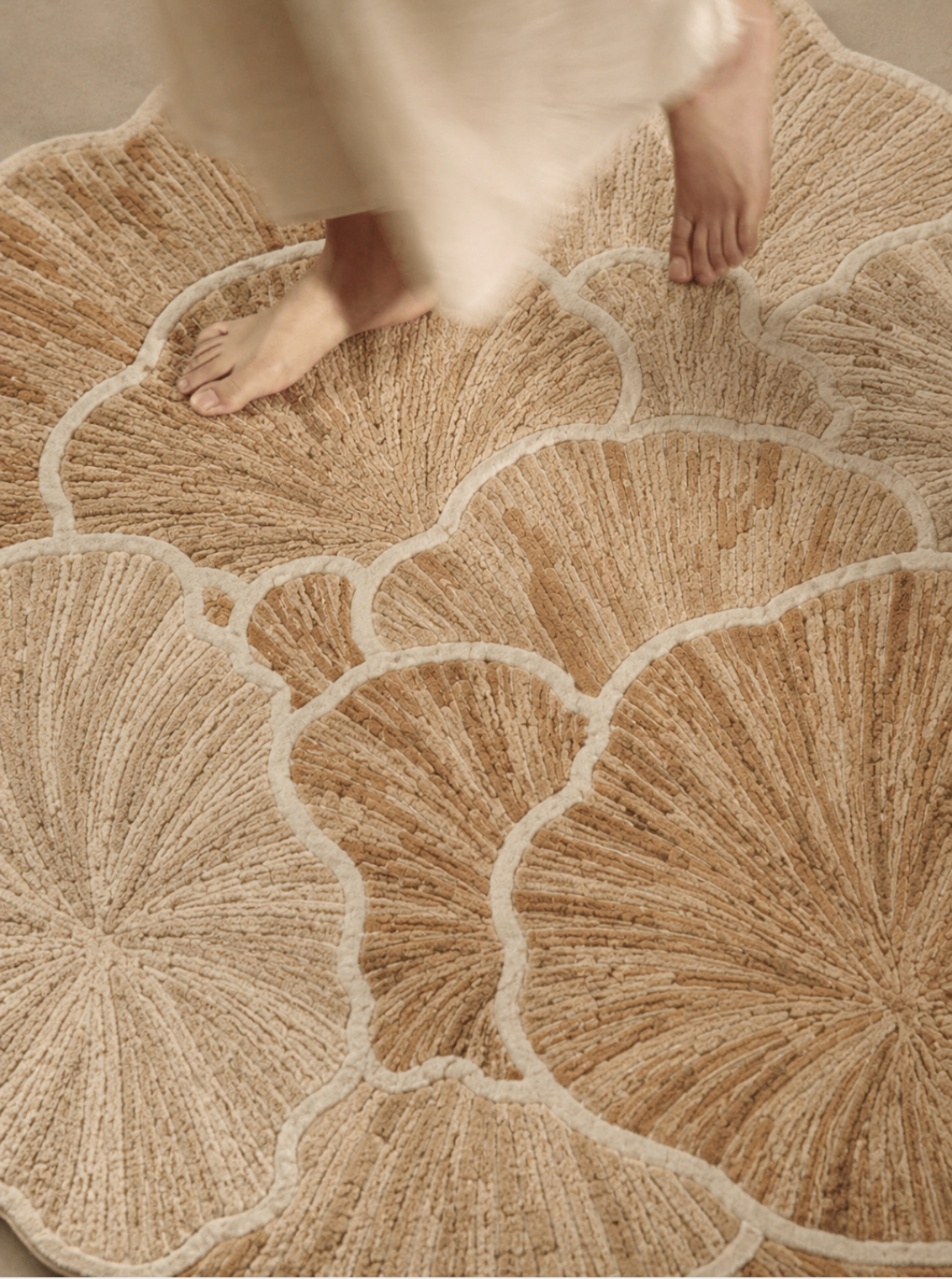 Hewn Earth Studio Petal rug featuring a soft, floral-inspired design with petal motifs on a cozy, textured surface.