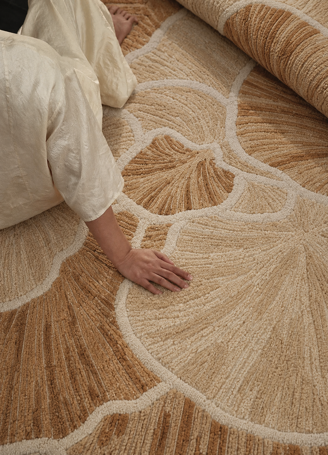 Close-up of the Petal rug from Hewn Earth Studio, showcasing intricate floral pattern and soft, textured fabric.