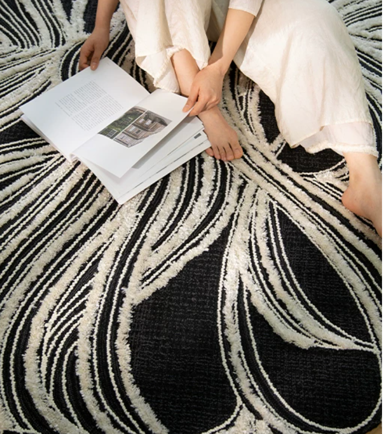 Hewn Earth Studio Plume rug featuring a handwoven design with soft, textured fibers in natural tones.