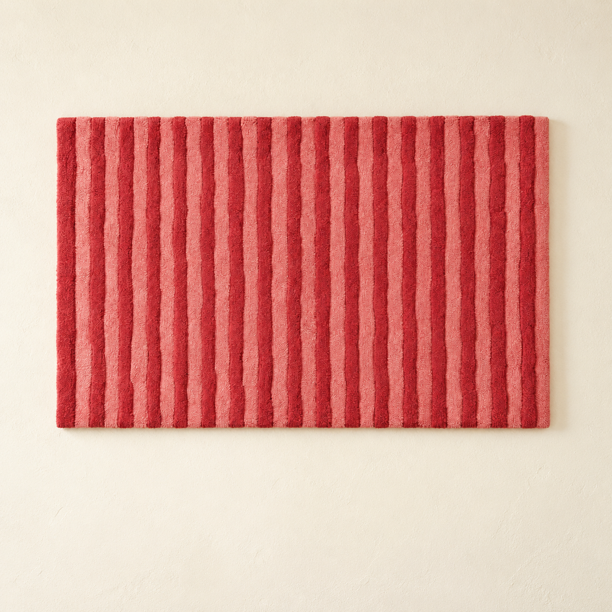 Hewn Earth Rose Ribbon Rhythm wall art featuring a vibrant pink and red ribbon design on a neutral background.