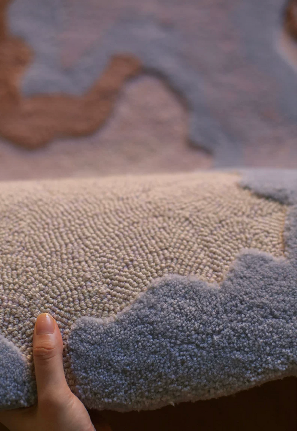 Hewn Earth Studio Strata handwoven rug with textured pattern in natural earthy tones, showcasing intricate craftsmanship.