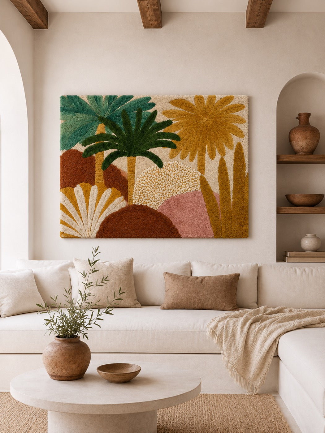 A hand-tufted wool palm and fan-flower landscape in ochre, teal and rust hung above a cream sofa in a beamed plaster room