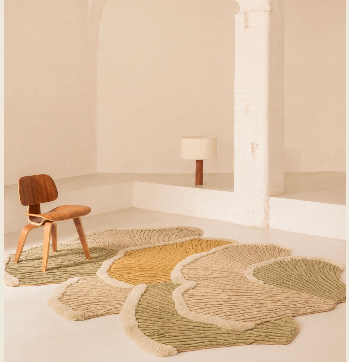 A hand-carved New Zealand wool rug unrolled across a warm floor